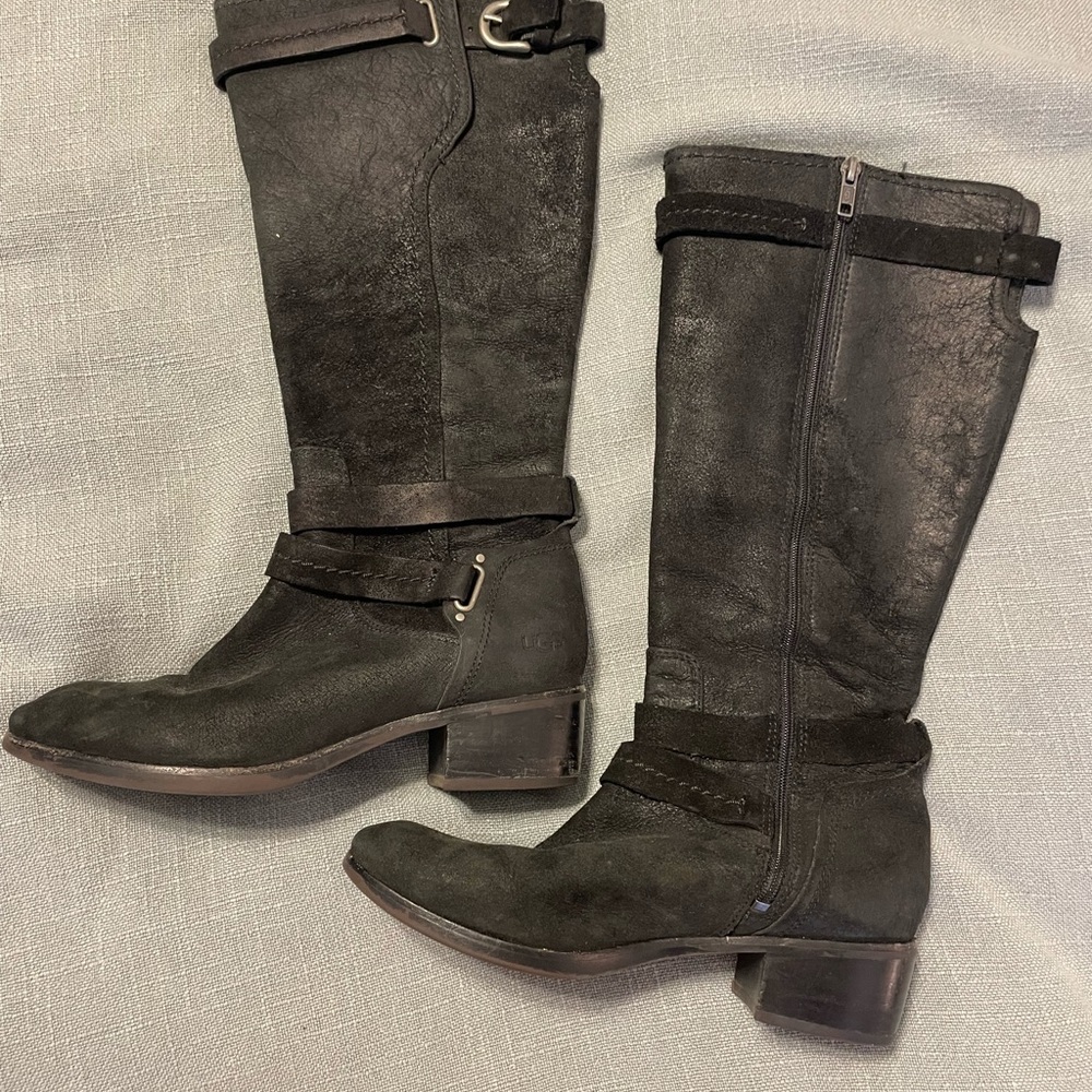 Black tall UGG boots.